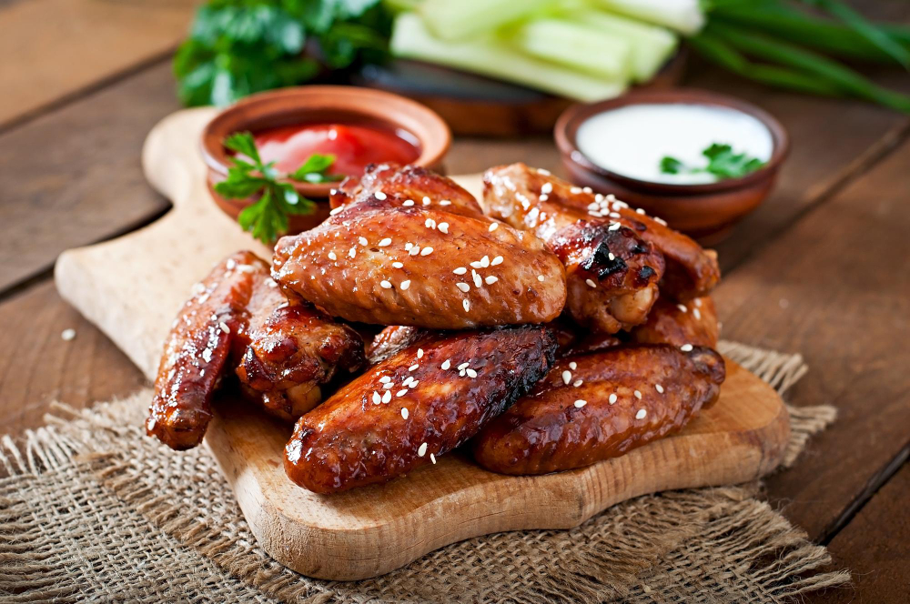 Crispy wings with dipping sauces on Poko Loko